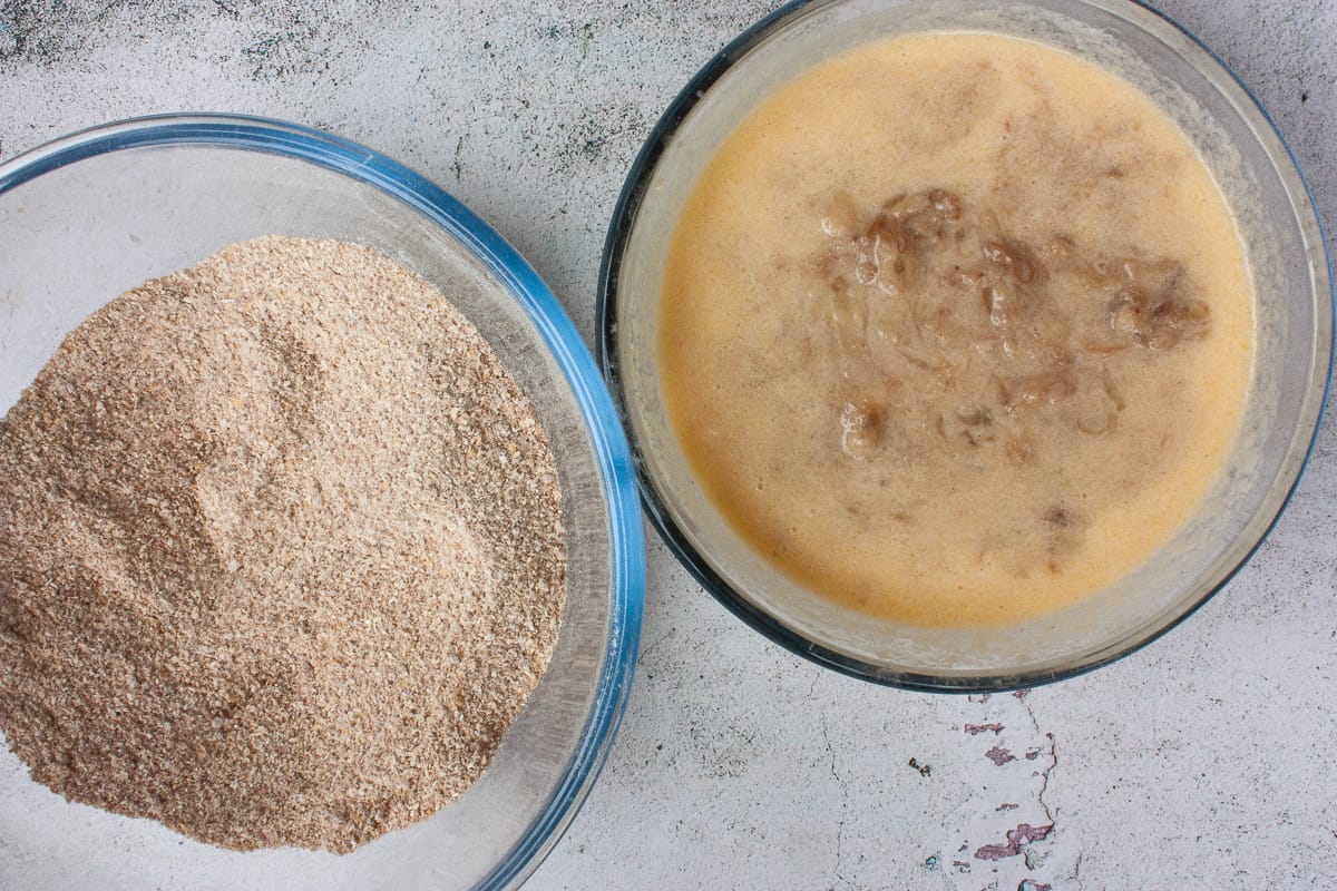 Dry ingredients and wet ingredients in glass bowls, ready to combine.