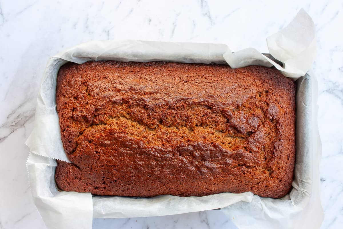 Deeply brown ginger loaf cake fresh out of the oven.