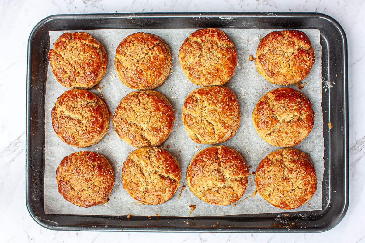 Bronzed baked scones on a baking sheet.