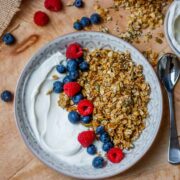 Granola in a bowl with yoghurt and fresh fruit.