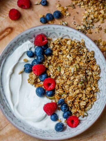 Granola in a bowl with yoghurt and fresh fruit.