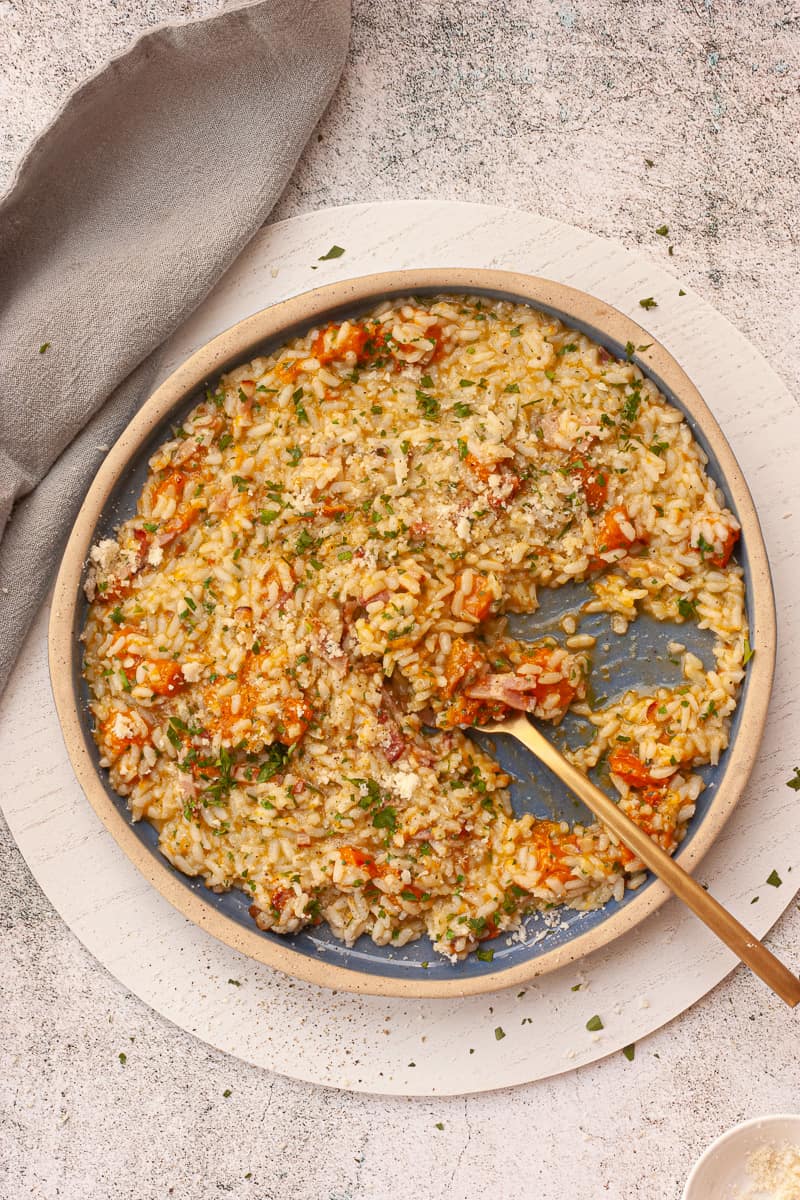 Oozy risotto on a blue plate.