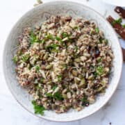 Top view of quinoa salad in a patterned bowl.