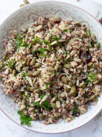 Top view of quinoa salad in a patterned bowl.