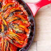 Baked ratatouille tian in a cast iron pan.