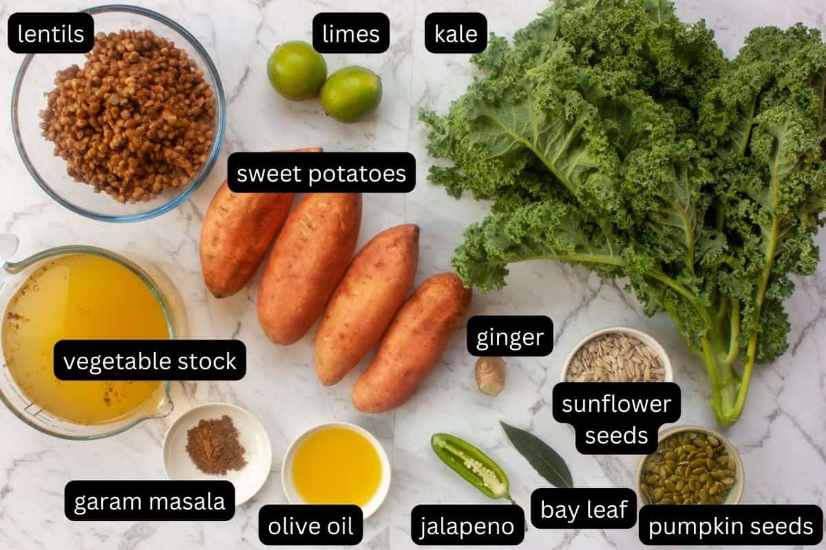 Annotated flat lay of ingredients needed to make sweet potato stew with kale and lentils.